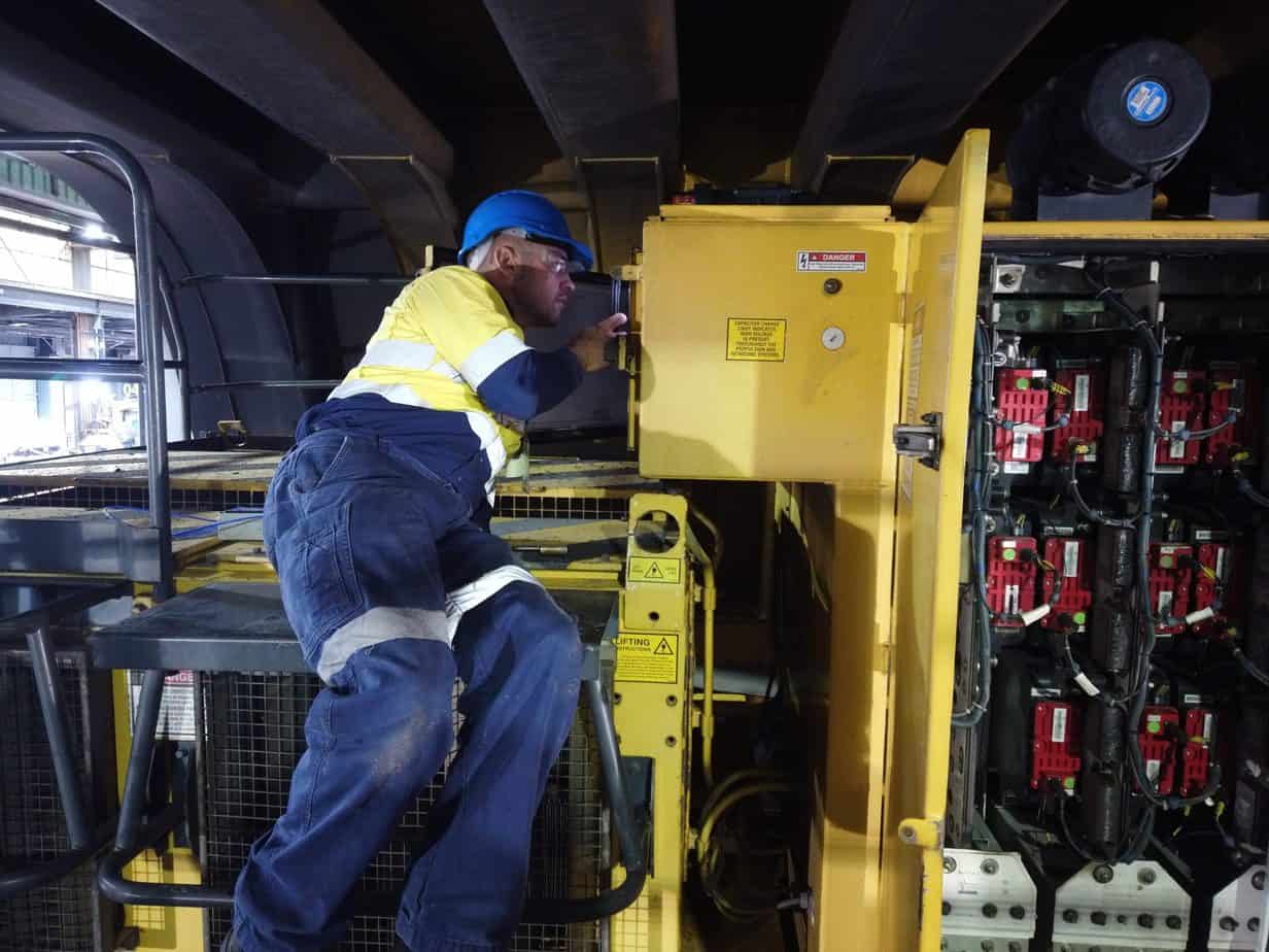 Simon servicing a BreatheSafe system installed on a high voltage cabinet