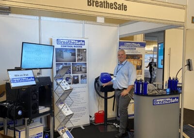 High-voltage respirator disinfection system exhibit at BreatheSafe booth, showcasing advanced air quality and safety solutions for control rooms and industrial environments.