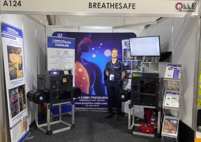 Innovative BreatheSafe respiratory monitoring and dust control solutions at trade show booth, showcasing airflow management technology for industrial and commercial applications in Australia.
