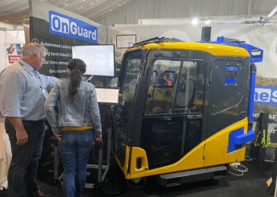 Autonomous industrial cleaning robot with advanced air filtration technology at the BreatheSafe booth, demonstrating innovative air purification solutions for occupational safety and clean environments.