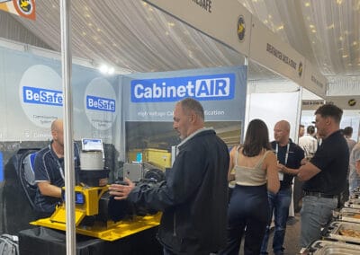 High voltage cabinet testing equipment at BreatheSafe booth during industry trade show.