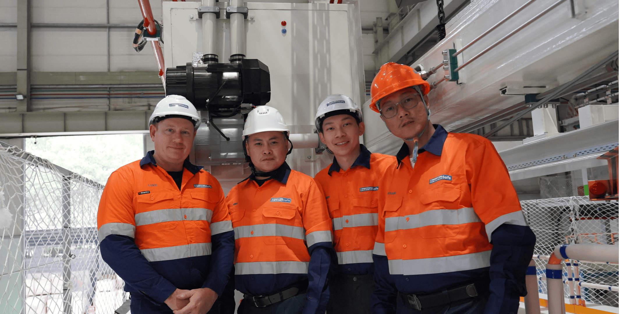 Team of underground mining workers in safety gear using OnGuard safety system for enhanced mine safety.
