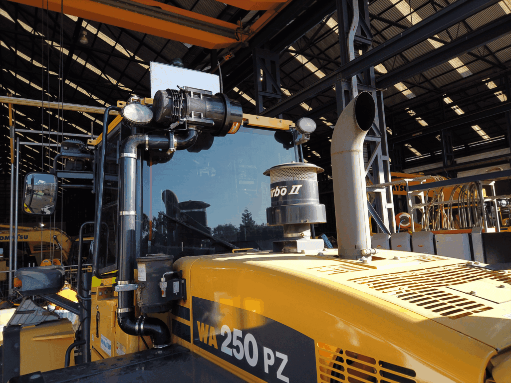 Image of a BreatheSafe air filtration system installed on a Komatsu WA250PZ loader